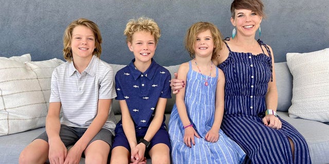 woman three children two sons daughter