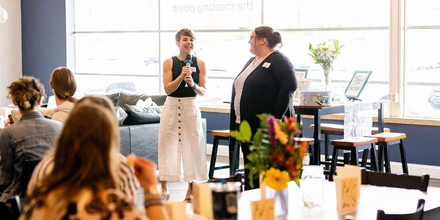 two women standing