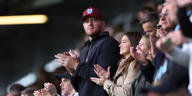 J.J. Watt looks on from the stands