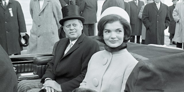 Jackie Kennedy and JFK in convertible