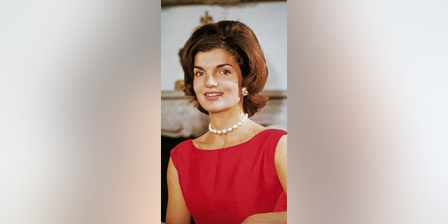 Jackie Kennedy red dress smiling