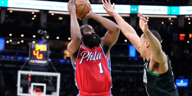 James Harden shoots over Malcolm Brogdon