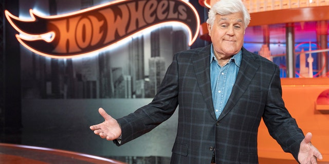 Jay Leno wears plaid blazer with denim shirt in Hot Wheels promotions