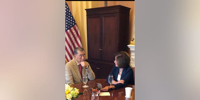 Jimmy Lai in discussion with Congresswoman Nancy Pelosi.