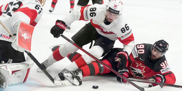 Joe Valeno fights for the puck