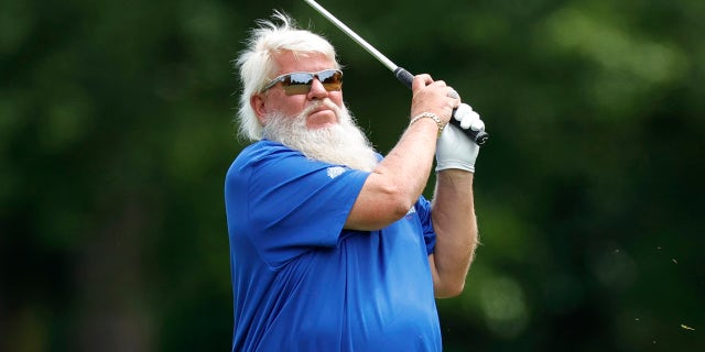 John Daly finishes swing