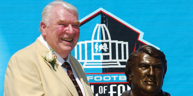 John Madden with a NFL Pro Football Hall of Fame