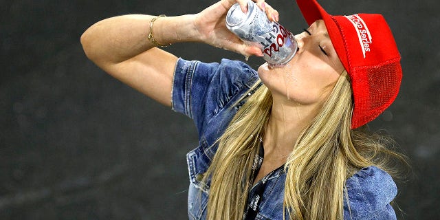 Katelyn Larson chugs a beer