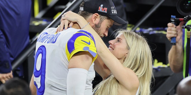 Kelly Stafford hugs her husband