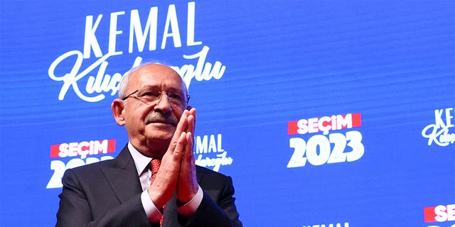 Kemal Kilicdaroglu claps his hands together