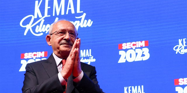 Kemal Kilicdaroglu claps his hands together