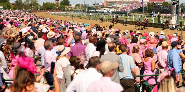 Spectators watching the horse finish