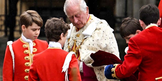 Britains King Charles arrives in the Diamond Jubilee State Coach from Buckingham Palace