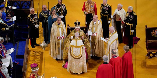 King Charles III receives The St Edward's Crown during his coronation ceremony in Westminster Abbey, London.