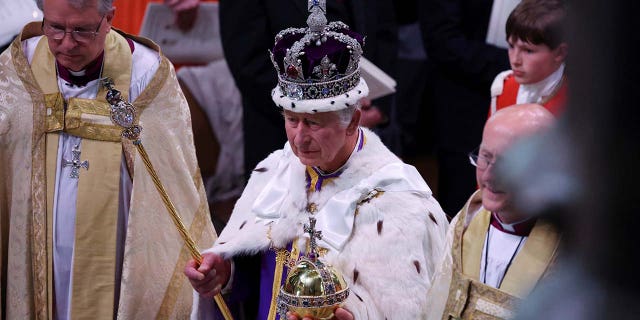 Britains King Charles departs following their coronation ceremony at Westminster Abbey