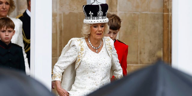 Camilla wearing a white goiwn with a crown