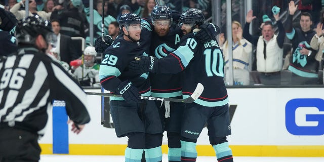 Kraken players celebrate goal