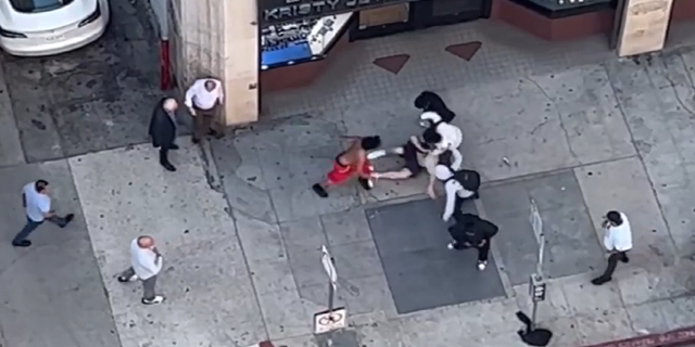 Cyclists attack person on sidewalk in Los Angeles