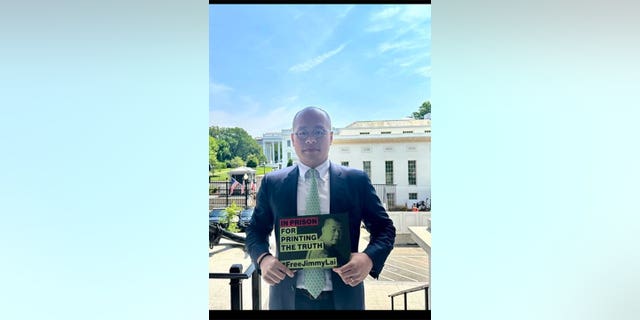 Lai poses for a photo at the White House.