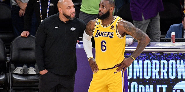 LeBron James talks to coach Darvin Ham