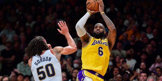 LeBron James shoots over Aaron Gordon