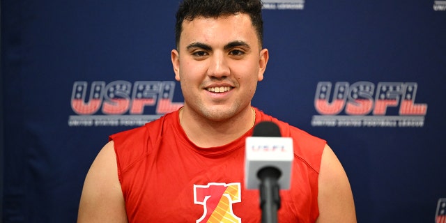 Luis Aguilar talks to reporters
