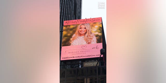 The Madison Brooks Foundation billboard is on display in Times Square