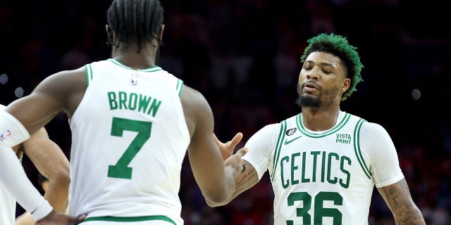 Marcus Smart gives Jaylen Brown a high five