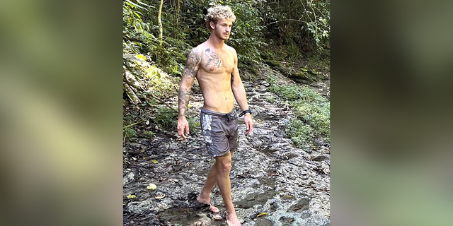 Daniel Penny on a hiking trail.