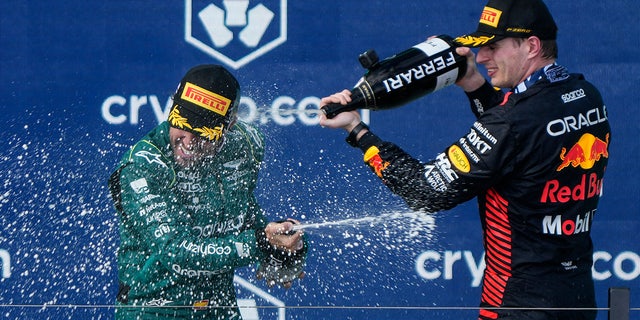Max Verstappen sprays Fernando Alonso
