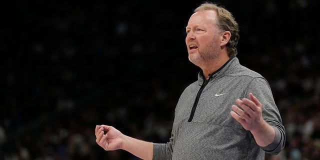 Mike Budenholzer reacts on the court