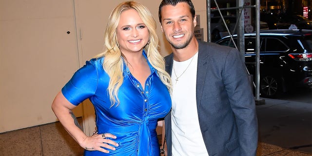 Miranda Lambert smiling with her husband Brendan McLoughlin