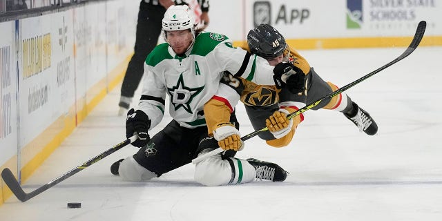 Miro Heiskanen fights for the puck