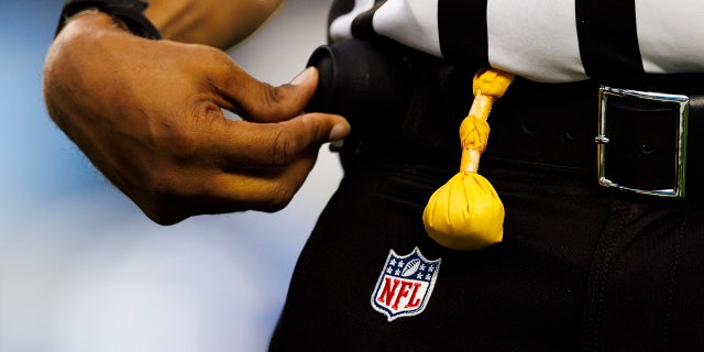 NFL referee with a flag in hand