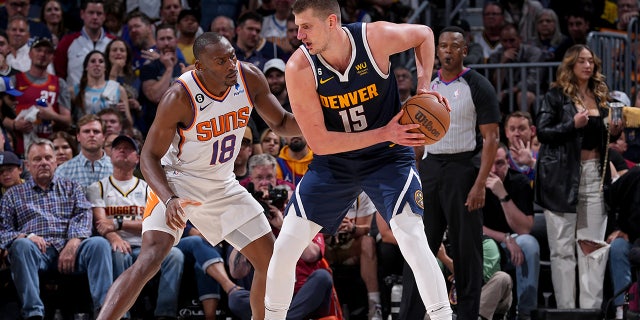 Nikola Jokic handles the ball during a playoff game