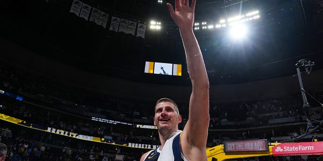 Nikola Jokic smiles after a game