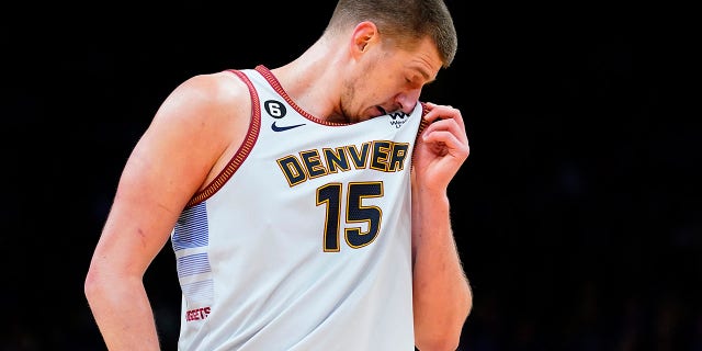 Nikola Jokic wipes his face