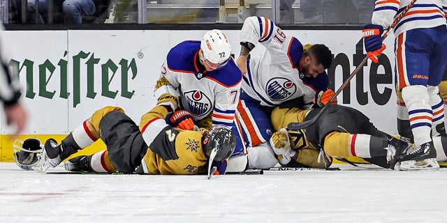 Oilers players in a fight