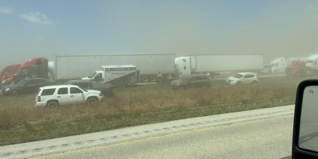 A view of vehicles in a dust storm,