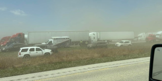 A view of vehicles in a dust storm,