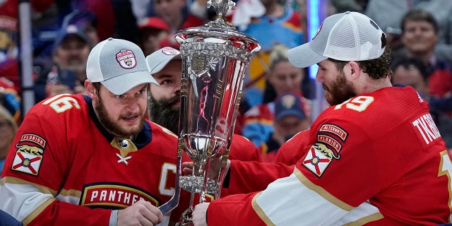 Matthew Tkachuck holding the trophy