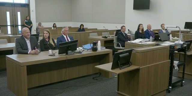 Gabby Petito's parents and their lawyer Pat Reilly on left