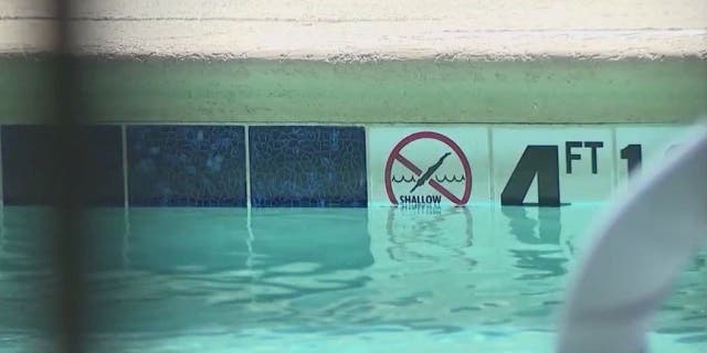 Pool sign at Phoenix hotel where child drowned