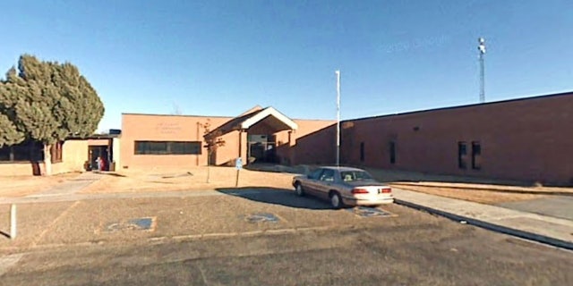 school parking lot and building