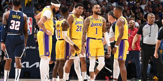 Los Angeles Lakers players look on