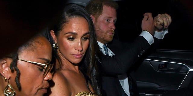 Meghan Markle, Prince Harry and Doria Ragland sit in the back of a New York City taxi cab