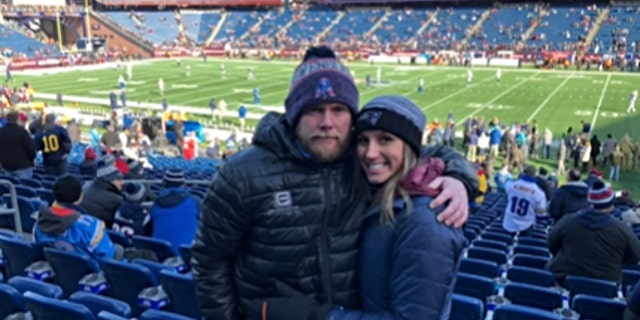 Eric and Kouri Richins at football game