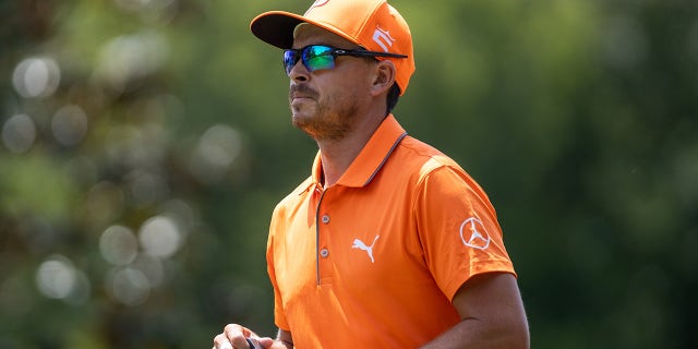 Rickie Fowler walks on course