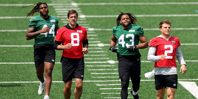 Aaron Rodgers and Zach Wilson during a Jets workout