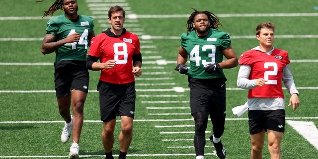Aaron Rodgers and Zach Wilson during a Jets workout